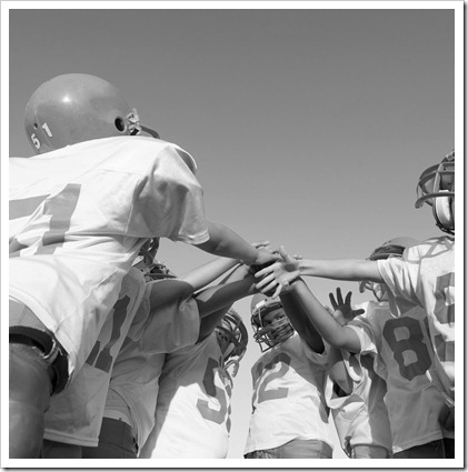 Team Huddle Before the Game --- Image by © Royalty-Free/Corbis